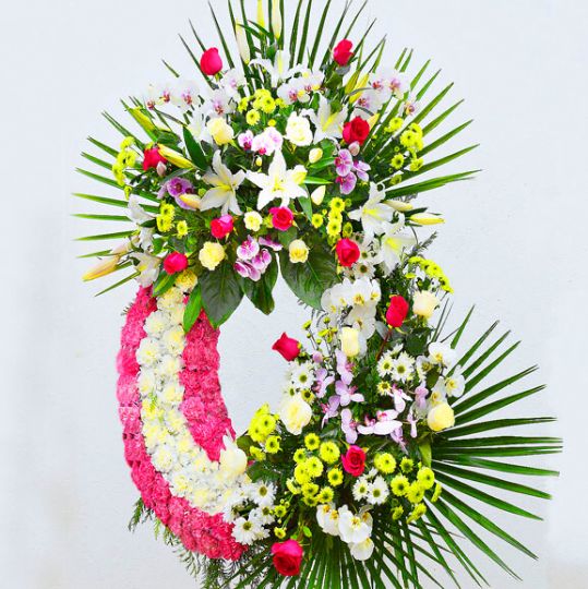 corona de flores para funeraria de dos cabeceras