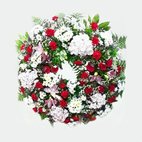 corona de flores funeraria blanca y roja